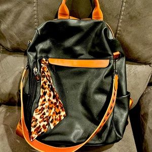 Lightly worn black leather back pack